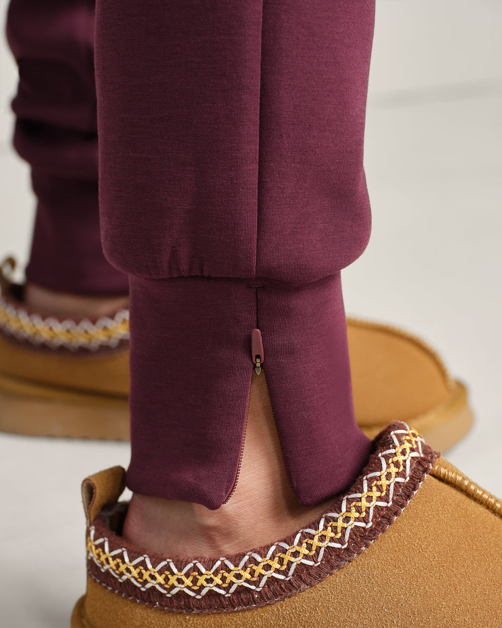 Rhone DreamGlow Taper Leg Pant- Bordeaux Red