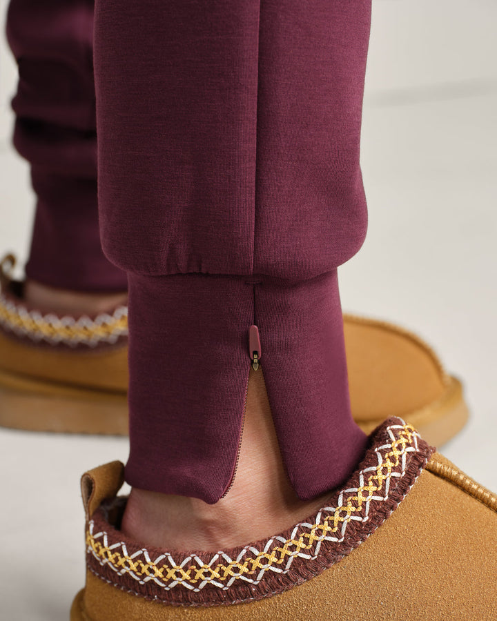 Rhone DreamGlow Taper Leg Pant- Bordeaux Red