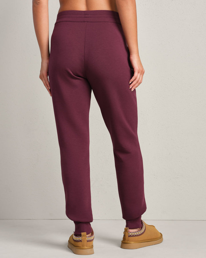 Rhone DreamGlow Taper Leg Pant- Bordeaux Red